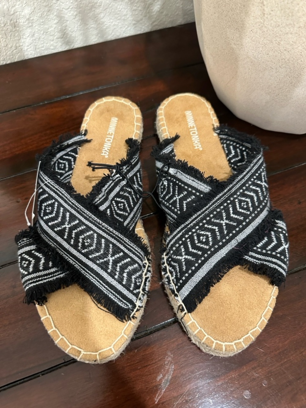 Minnetonka Black and Tan Woven Crisscross Sandals